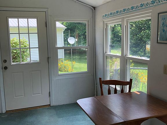 Screened in 3 season porch with ceiling fan.