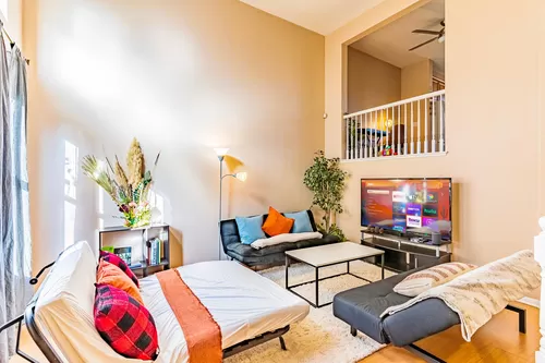 Stretch out and enjoy the sunny living space & endless entertainment options - 1860 E 12th St E