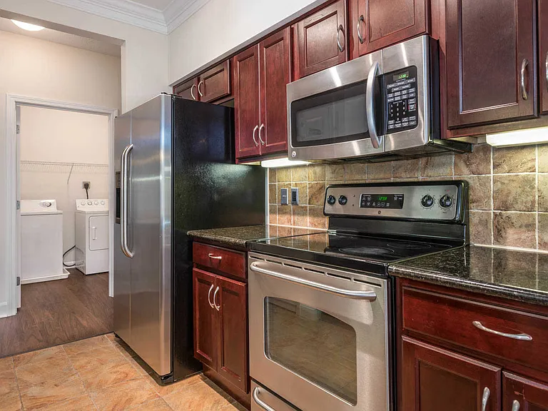 Kitchen with Stainless Steel Appliances and In-Home Washer and Dryer