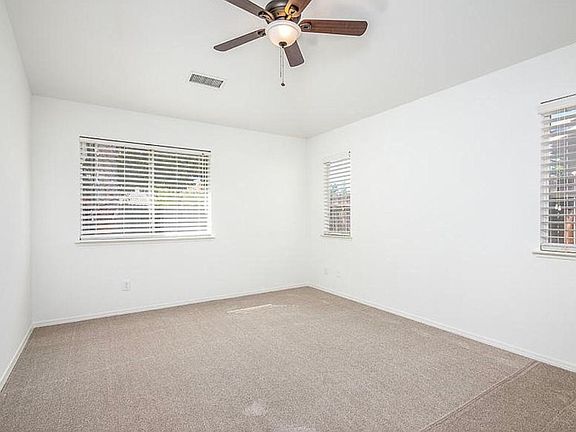 Master bedroom with 3 windows, bright and airy