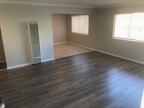 Main living room with new flooring and new heaters