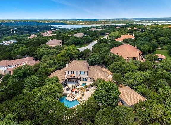 Lake Travis in view and private lush surroundings.