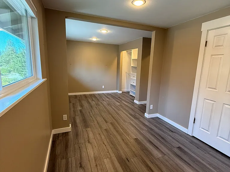 Bedroom #2 on upper level. It is extra large (was two small individual rooms)! This is great for someone who needs more space to retreat to.