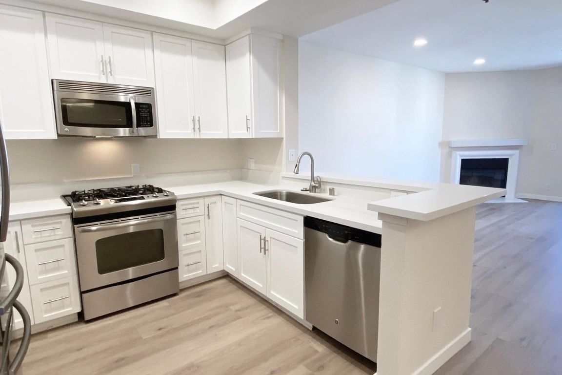 Kitchen and living room of apartment #201