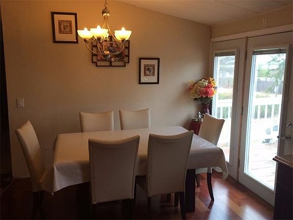 Dining Room adjoining Kitchen and full light doors to the deck.