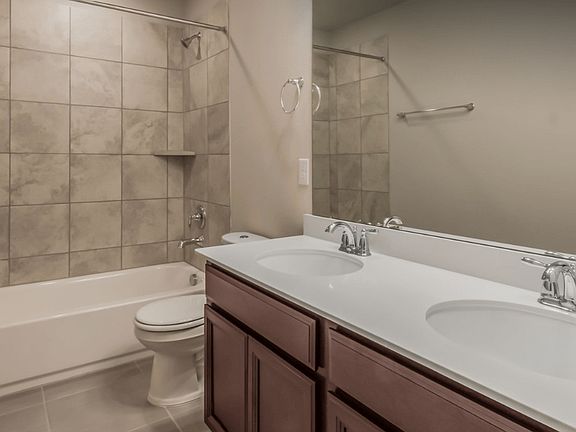 The secondary bath is perfect for kids or guests.