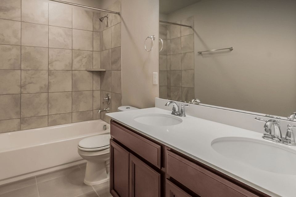 The secondary bath is perfect for kids or guests.