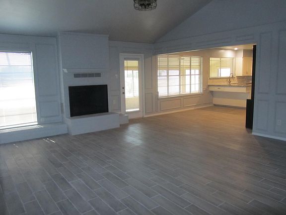 family room with wood burning fireplace