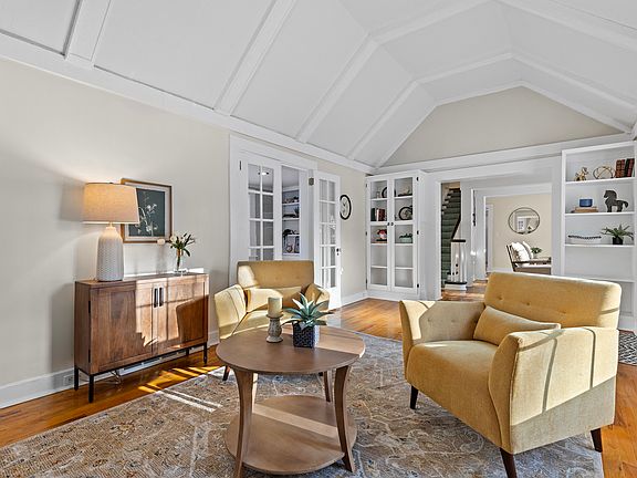 Formal living room with view toward office/study and the main living area
