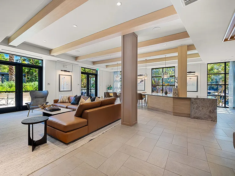 Clubroom lounge with designer seating and walls of windows