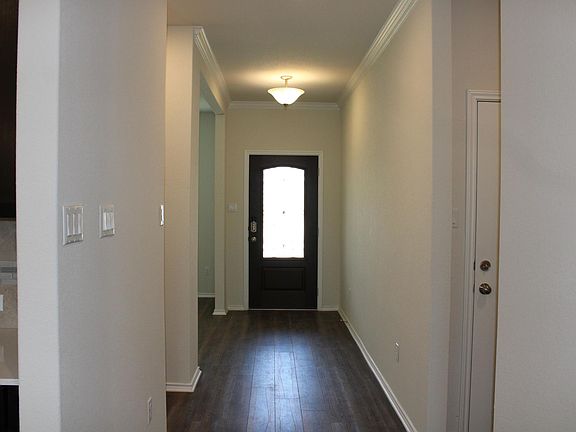 The room at the entry way could be used as a formal dining room, play room, or office space