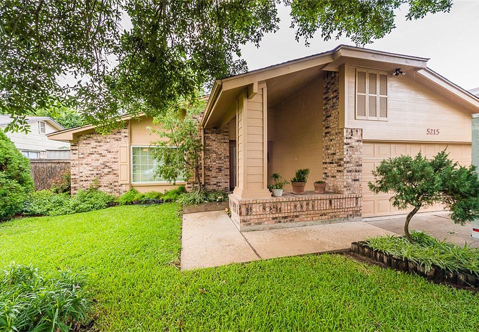 Stunning curb appeal with numerous shade trees