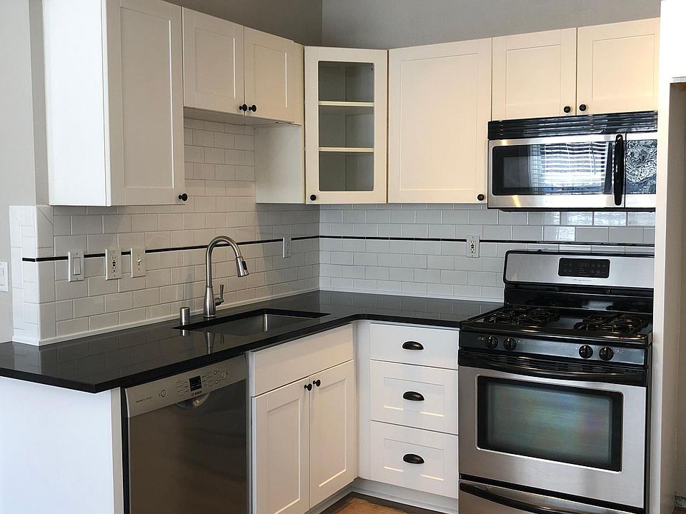 Gas range and mounted microwave - all stainless appliances.