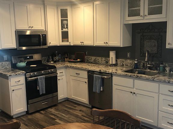 Stainless dishwasher, stove, and microwave