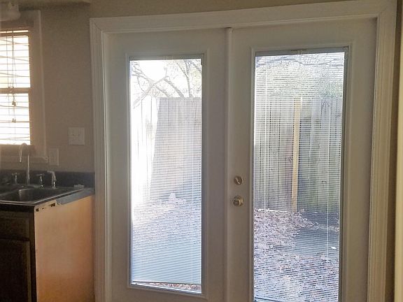 Doors to Fenced patio