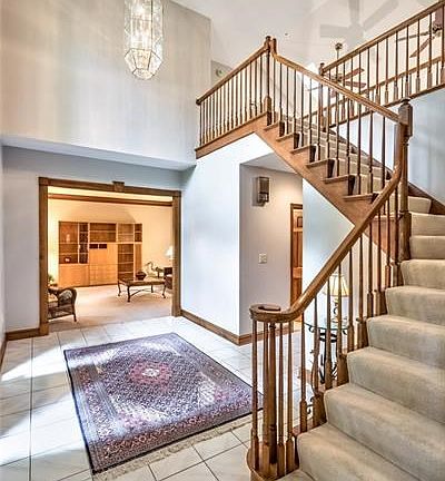 Grand two story entry with turned staircase, large picture window bringing in lots of natural light!