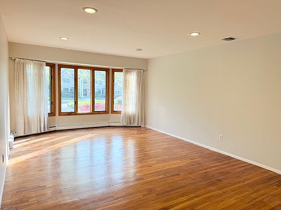 Living room freshly painted with beautiful hardwood floors