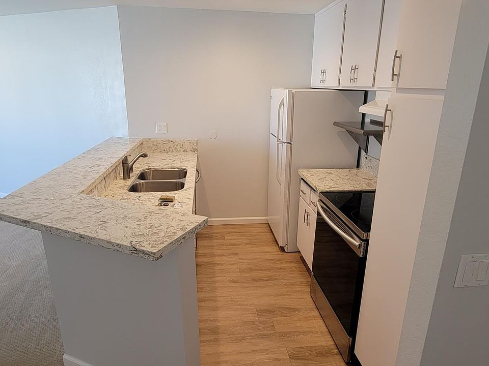 Kitchen with quartz countertops and modern appliances