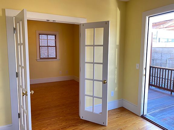 Second floor room with exterior door to deck. Opposite view from next photo