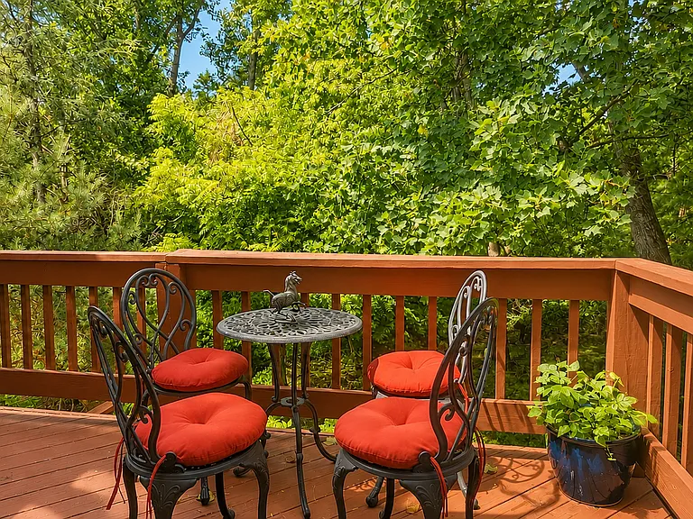 Upper deck provides peaceful, quiet outdoor space for morning coffee, grilling, entertaining and enjoying the surrounding woodland views.