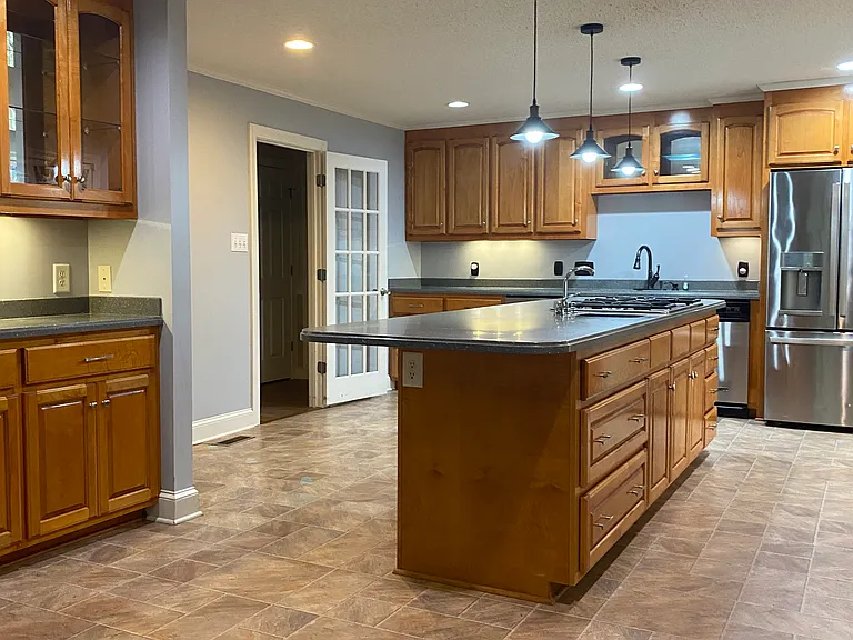 Large Kitchen with gas range some appliances recently replaced.