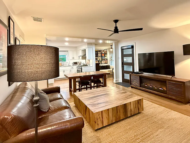 Living Room with 55" TV w Roku Set Up. Faux Fireplace.