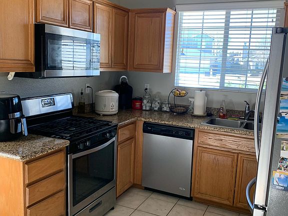 Kitchen with Stove/Oven, Microwave and Dishwasher. Refrigerator will be left for tenant's use but will not be warranted.