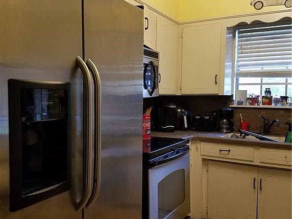 Cozy kitchen has everything you'd need.