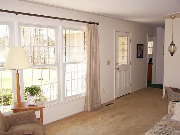 Wall of triple pane windows in the living room.