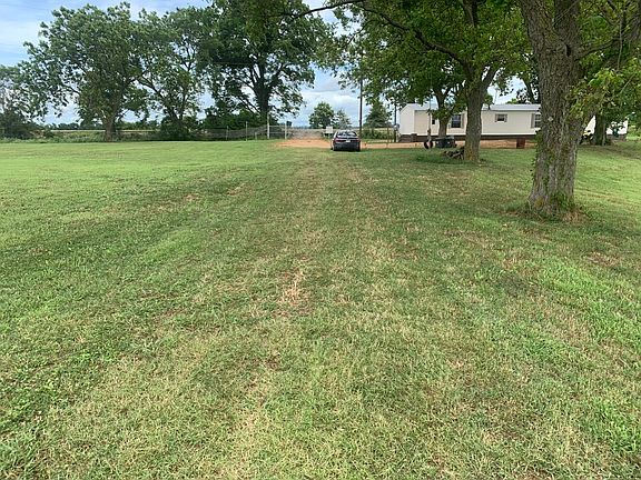Mobile home and pecan trees