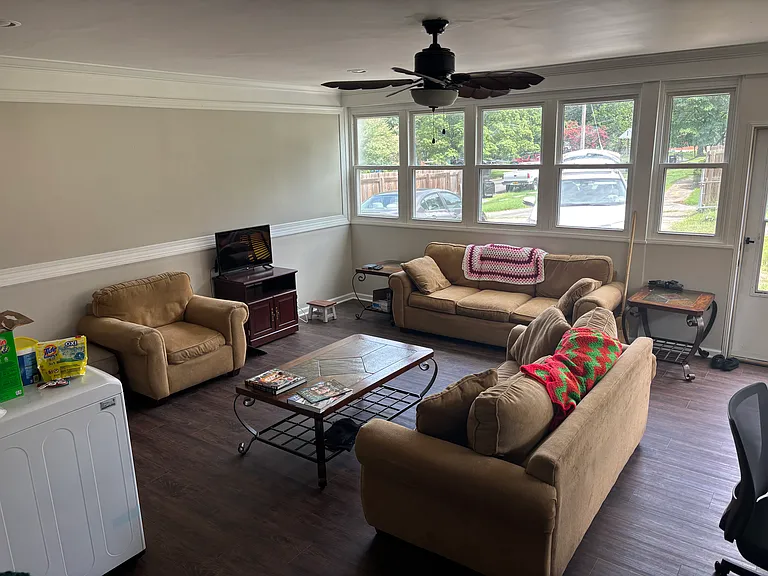 Sun room with washer/dryer unit towards the back of the house, off of the kitchen
