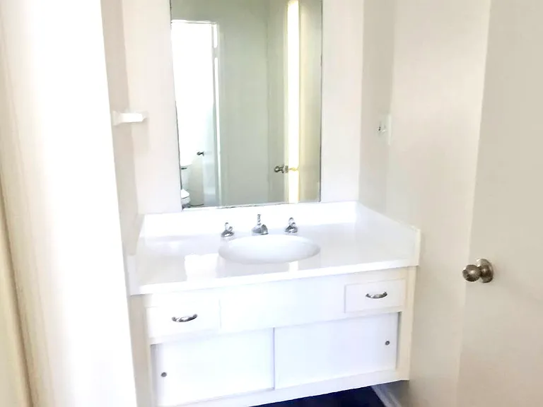 Main bedroom vanity and sink. (Lights off)