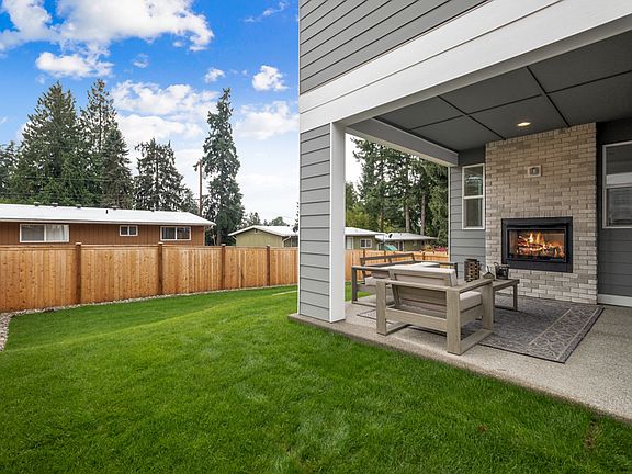 Covered outdoor living with fireplace