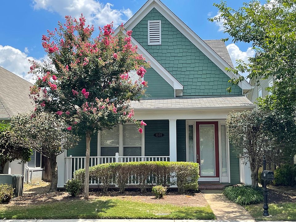 Adorable front porch with plenty of room for rocking chairs to sit out and enjoy your covered patio.