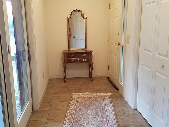 Entry with coat closet. Utility closet nearby but not in picture.