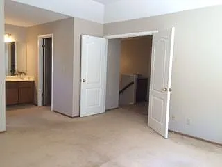 main bedroom , double doors, full bath w/ oval tub, lg. walk in designer closet. freshly painted 2025., calming off white walls