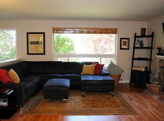 Spacious living room with large picture windows for tons of natural lighting.