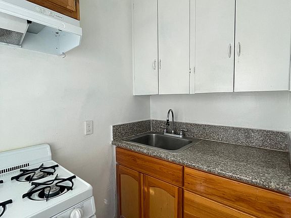 separate kitchen- comes with fridge & stove