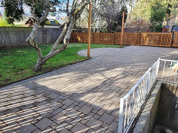 Back patio, fenced yard.
