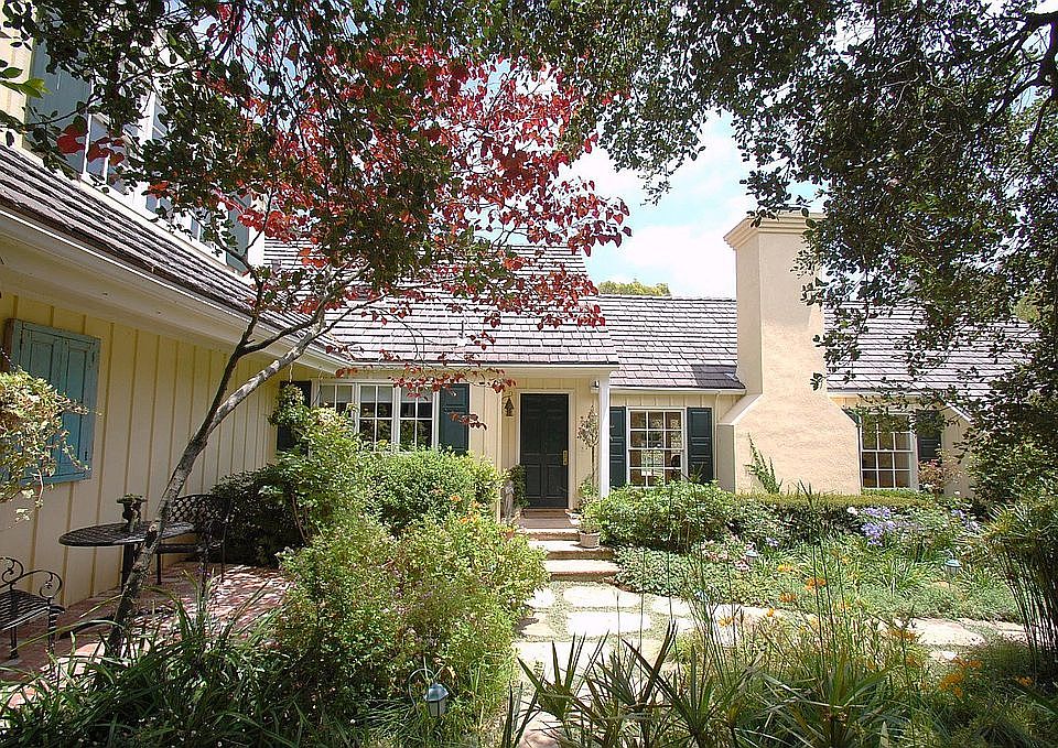 Lush mature landscaping for this Estate