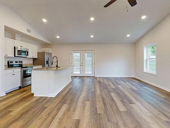 Kitchen, Living Room Dining Room and doors to back Patio