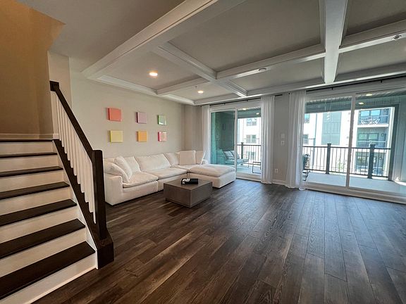 Living Room with Beam Ceiling