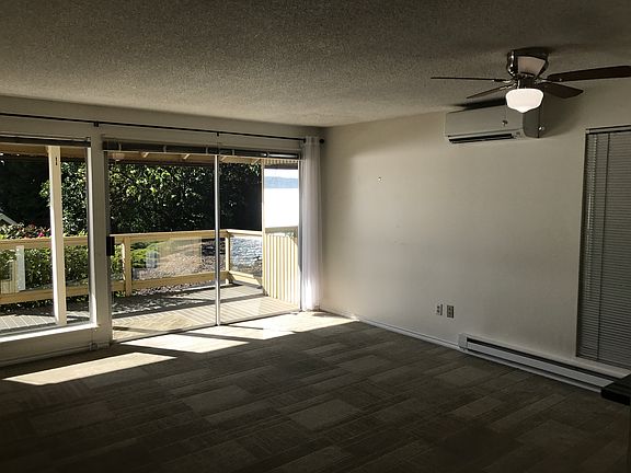 Lots of light coming in through the wall of windows leading