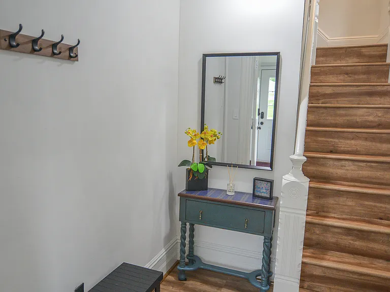 Foyer. Coats hanger. Please remove the shoes here after your unit entry point