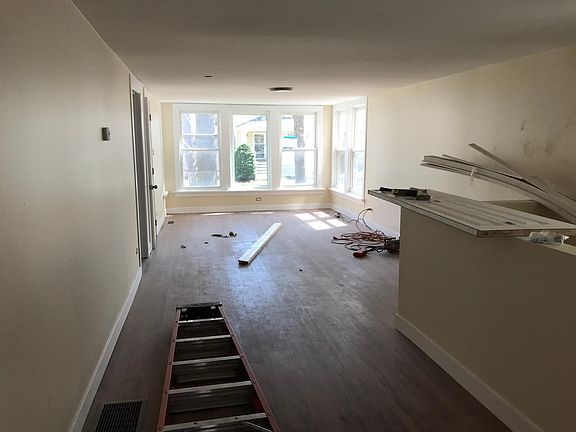 2019 Rehab! Picture taken from the kitchen entrance. Stairs to the right, two bedrooms to the left.