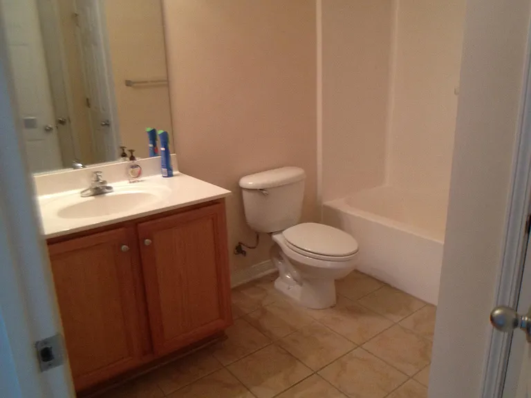 This is the picture of the upstairs bathroom. It has two entry doors.
One door is to the hallway and the other is to a large bedroom overlooking the common area back yard.