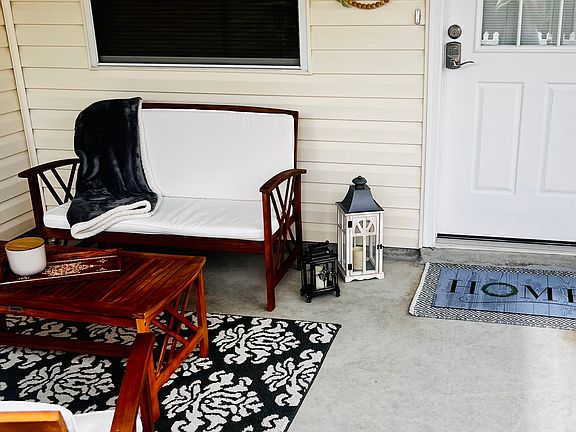 Entry into Villa with front screened porch.