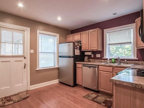 Updated kitchen wood floors and stainless steel appliances and recess lighting.