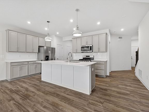 Gourmet kitchen with tons of natural light, HUGE island and tons of cabinetry