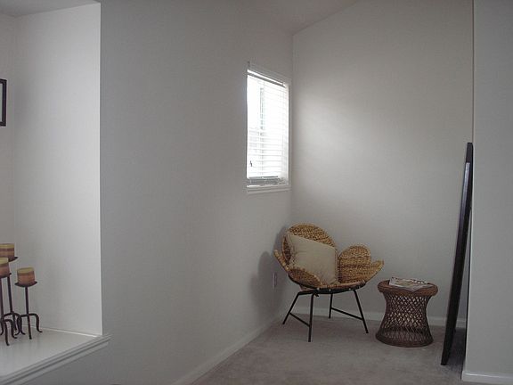 Seating area in corner of master bedroom (window seat to the left)